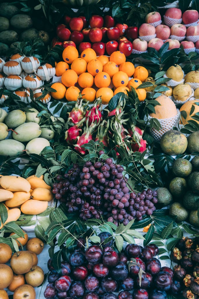 A colorful fruit assortment at a Vietnamese market stall showcasing fresh produce.