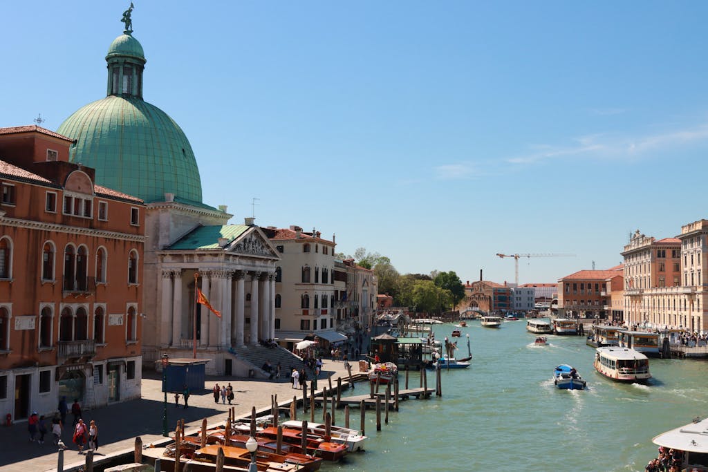 Charming view of Venice's Grand Canal with San Simeone Piccolo and boats.